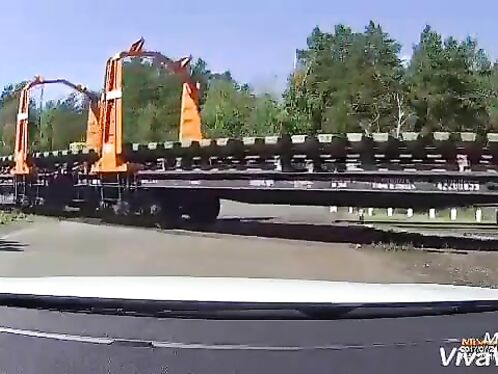 Semi Truck Tries To Drive Over Train Tracks
