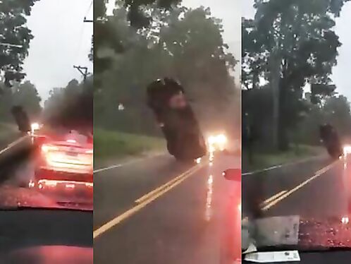 Car Stuck In Wires Looks Like It's Hanging In Mid-air