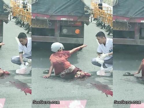 Paramedics Try To Help A Woman With A Foot Injury
