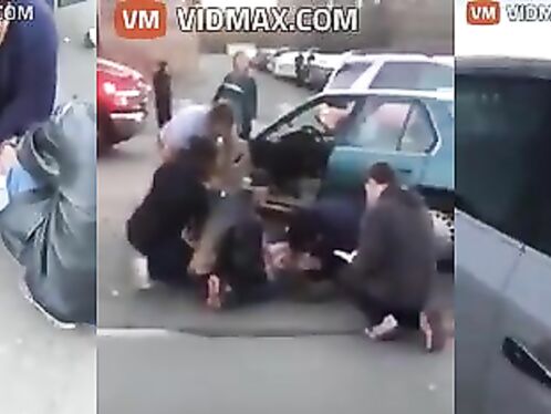 Nurse Performing CPR On Woman After Car Accident