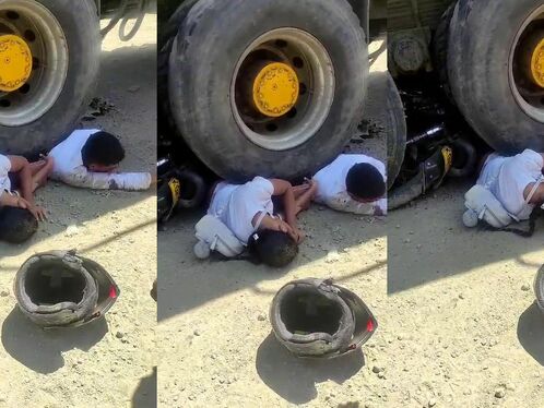 Couple On Motorcycle Falls Under Wheels Of Heavy Truck