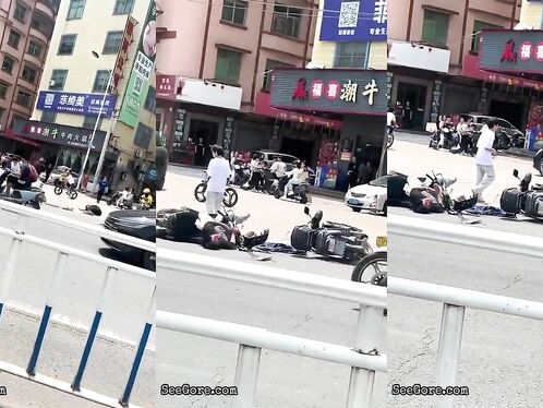 A Cyclist Without A Helmet Knocked Down Another Cyclist At An Intersection-01