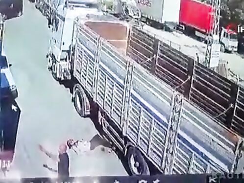 Squeezed Between Trucks