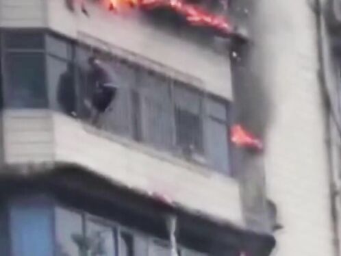 Heartbreaking Moment Man Clings To Burning Skyscraper