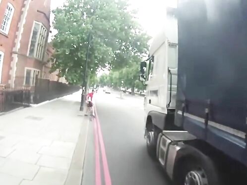 Cyclist Nearly Crushed By Truck While Crossing Busy Intersection