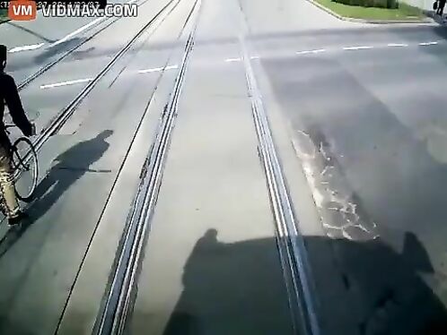 Cyclist Nearly Dies Trying To Overtake Tram