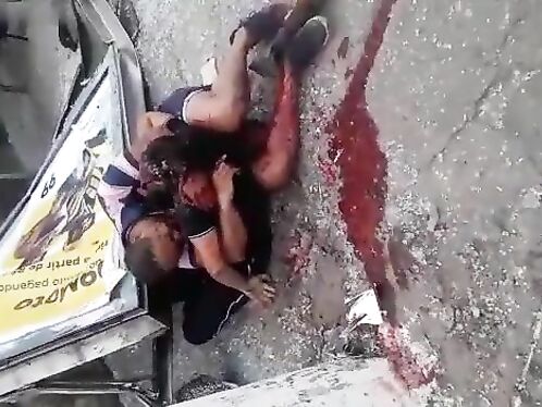 A Man Hugs The Body Of His Wife Who Died In The Accident