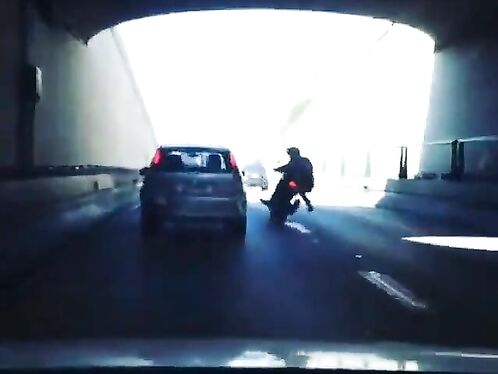 Man On Motorcycle Speeds On Highway, Kicks Car