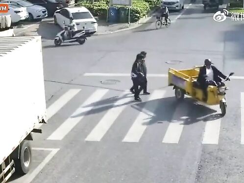 A Man Was Tied With A Rope While Crossing The Road