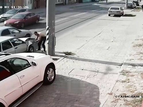 Man Jumps Onto Car Hood To Fix Dent