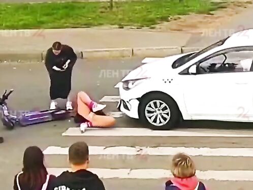 Young Scooter Girl Has Not Yet Learned The Traffic Rules