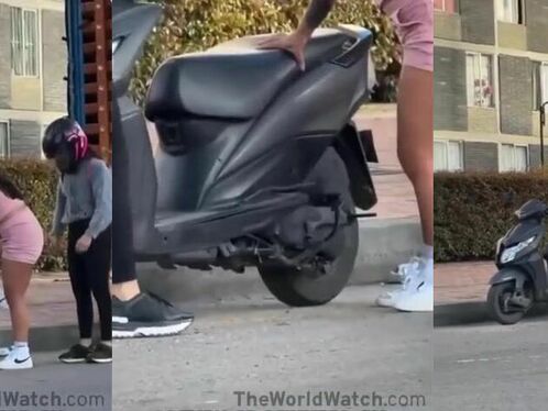 Women Trying To Figure Out How To Install A Kickstand On A Motorcycle