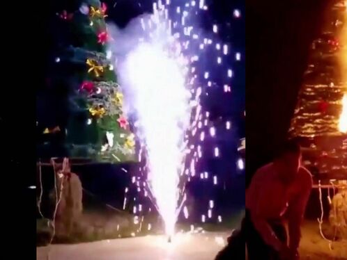 Fireworks Are Set Off On Both Sides Of The Glowing Christmas Tree