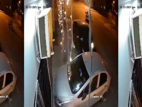 Homeless Man Crossing The Street With All His Belongings