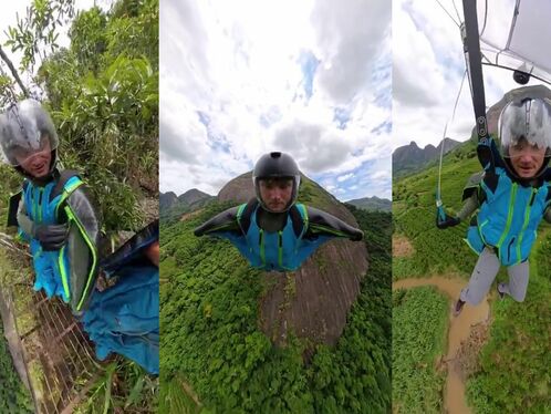 Man paraglides off a steep mountain in the countryside