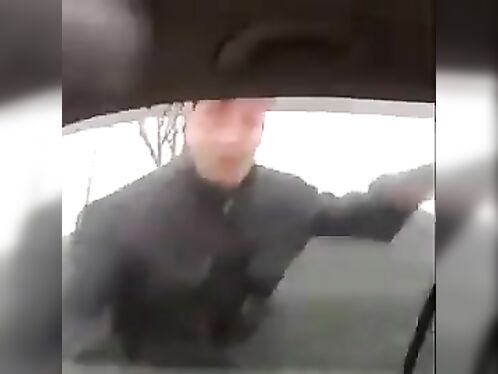 Man tries to smash a car window with his elbow