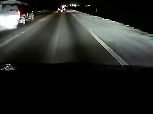 Overtaking On An Icy Highway In The Dark On A Snowy Day