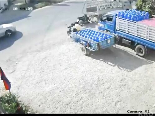 Bike Crashes Into Parked Truck