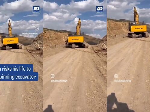 Man Stops A Spinning Excavator