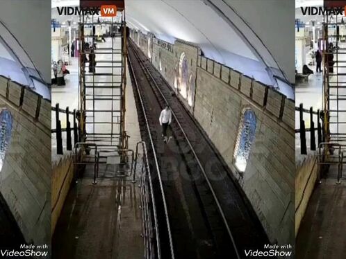A Woman Stands In Front Of A Moving Train