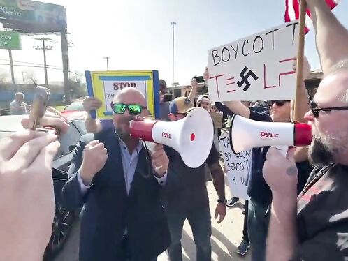 Alex Jones Drives Cybertruck Against Anti-Musk Protests