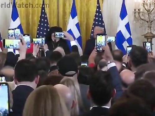 Audience Cheers As Archbishop Trump Presents Holy Cross