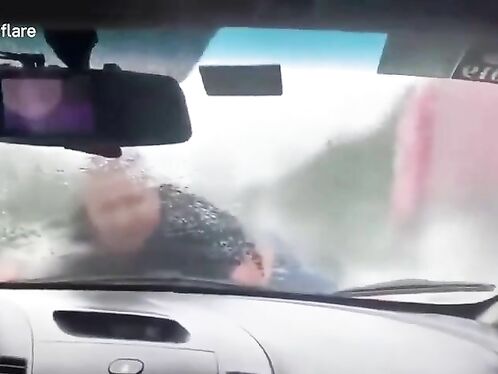 A Man Is Clinging Tightly To His Ex-wife's Car As She Speeds Along The Highway At 110 Km/h.