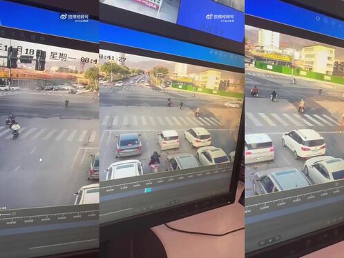 A man lays down on a busy crosswalk to stop traffic