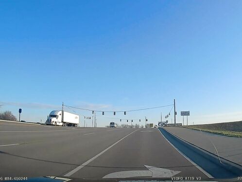 At 8 A.m., At A 7-8 Lane Intersection, The Traffic Light Was Red.