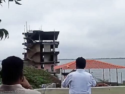 The Man Filmed The Building Collapsing After Being Hit By A Flying Rock.