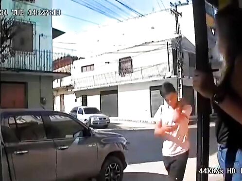 A Young Man Riding A Bicycle Narrowly Escaped Being Hit By Two People On The Road.