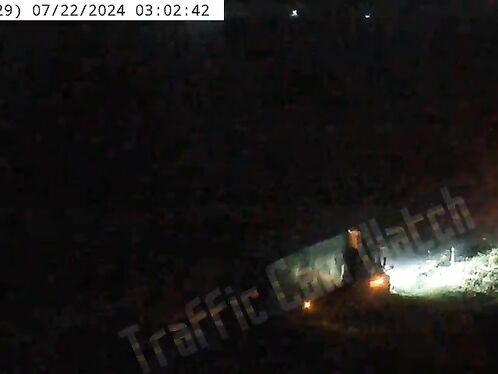 In Iowa, A Semi-trailer Truck Collided With A Parked Semi-trailer Truck And Overturned.