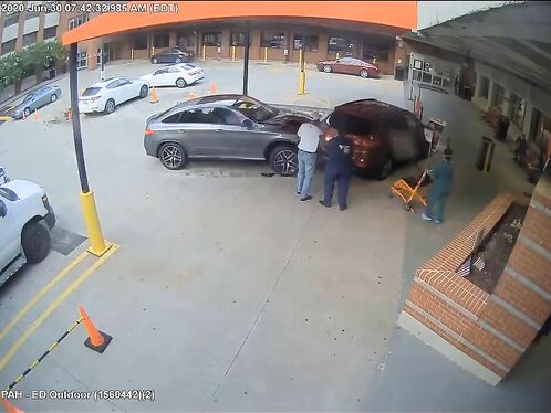 Surveillance Footage Shows A Car Speeding Into The Hospital's Emergency Room.