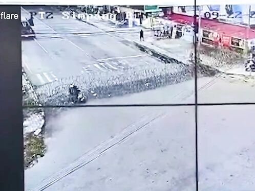 The Motorcyclist Crashed Into The Barbed Wire Fence Set Up By The Police.