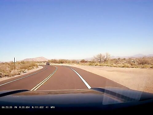 Car drifts into opposite lane on desert road