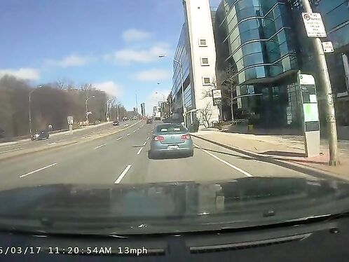 Car loses control, skids across intersection and crashes
