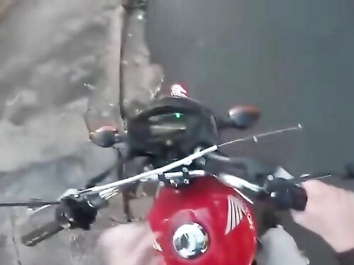 Rider takes a wild spill off his motorcycle