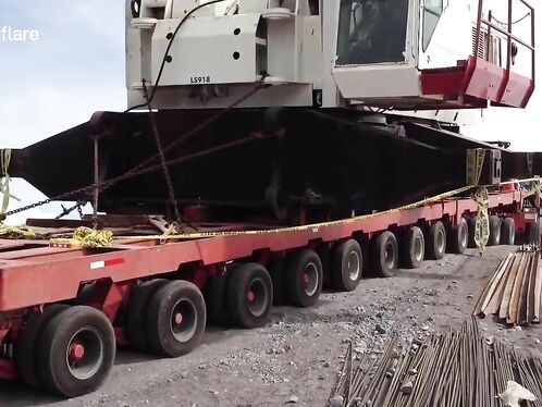 Crane crashes down hill