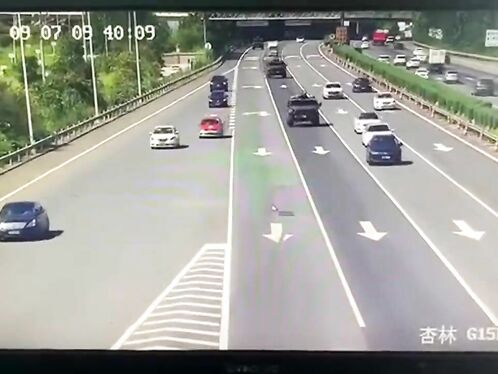 Woman Runs Across Highway as Cars Swerveto Avoid Her
