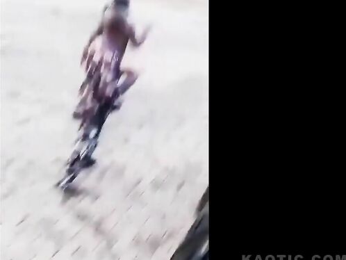 Motorcycle rider loses control and crashes under a car