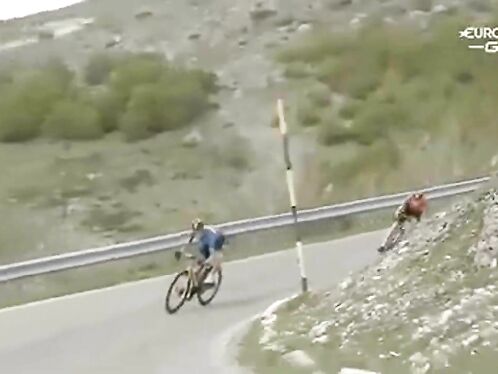 Cyclist almost flies off steep mountain road.