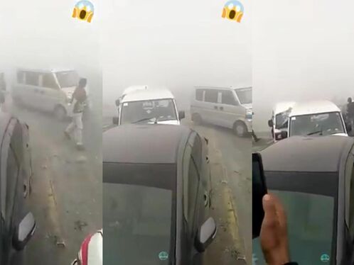 Men fight in the middle of the road