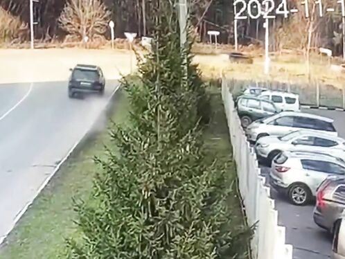 Man tries to load surfboard into car trunk
