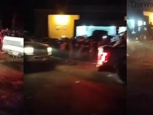 Police car slams into motorcycle on busy street