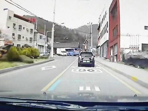 Car drives into construction explosion and survives