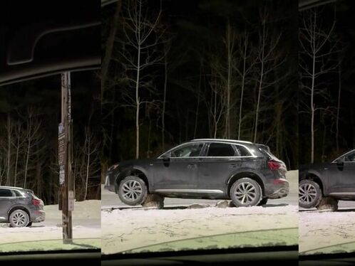 Car slides off snowy road and into pole
