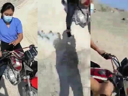 Woman crashes motorbike while riding on sand