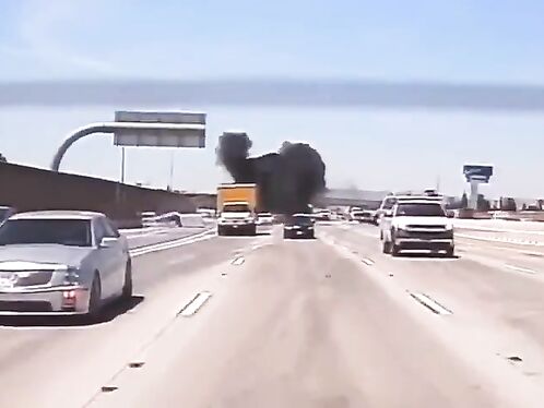 Car flips over and catches fire on the highway