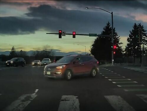 Car turns and sends biker flying