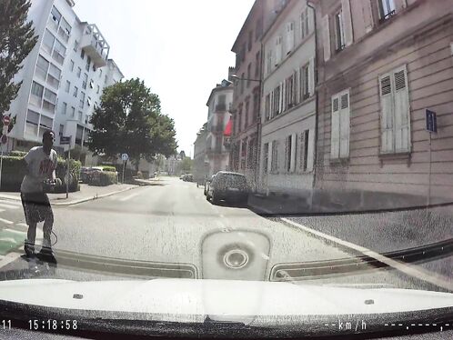 Car spins out of control on wet city street